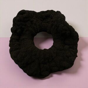 Hand-crocheted black scrunchie.